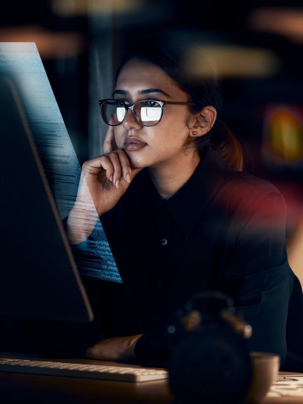 programming-cybersecurity-and-thinking-with-woman-at-computer-for-software-idea-and-coding-at-nig.jpg